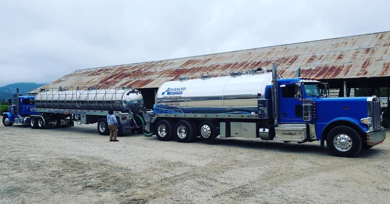 Advanced Sanitation tractor and tanker trailer, the rig that reaches the larger tanks on acreage properties