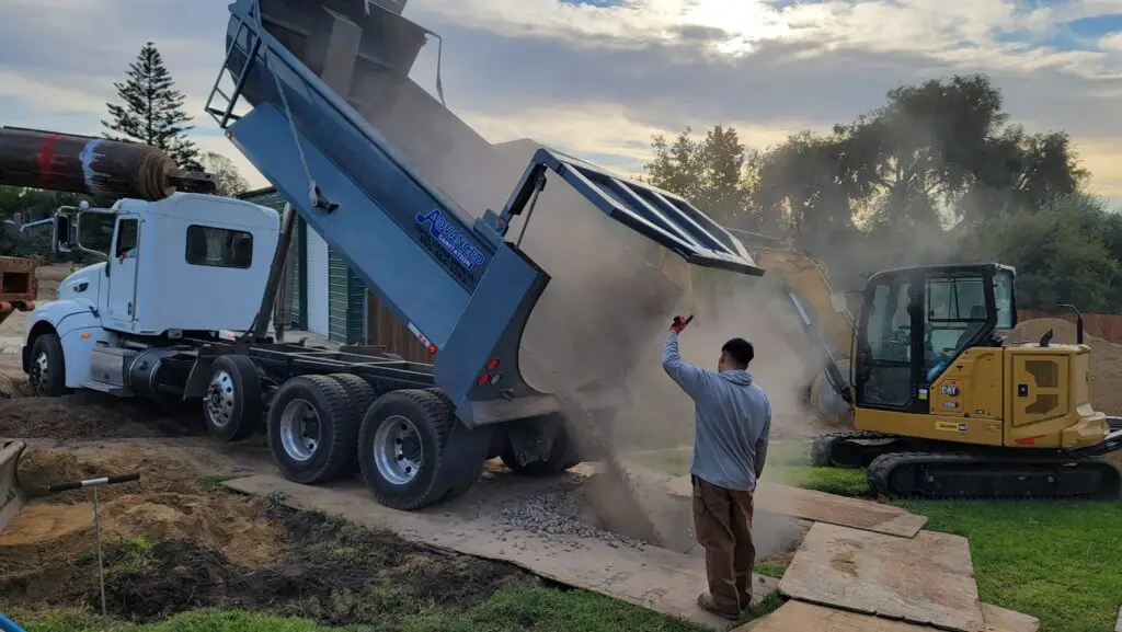 Septic System Installation in Ventura County by Advanced Sanitation Septic System Services, putting rock in a new seepage pit